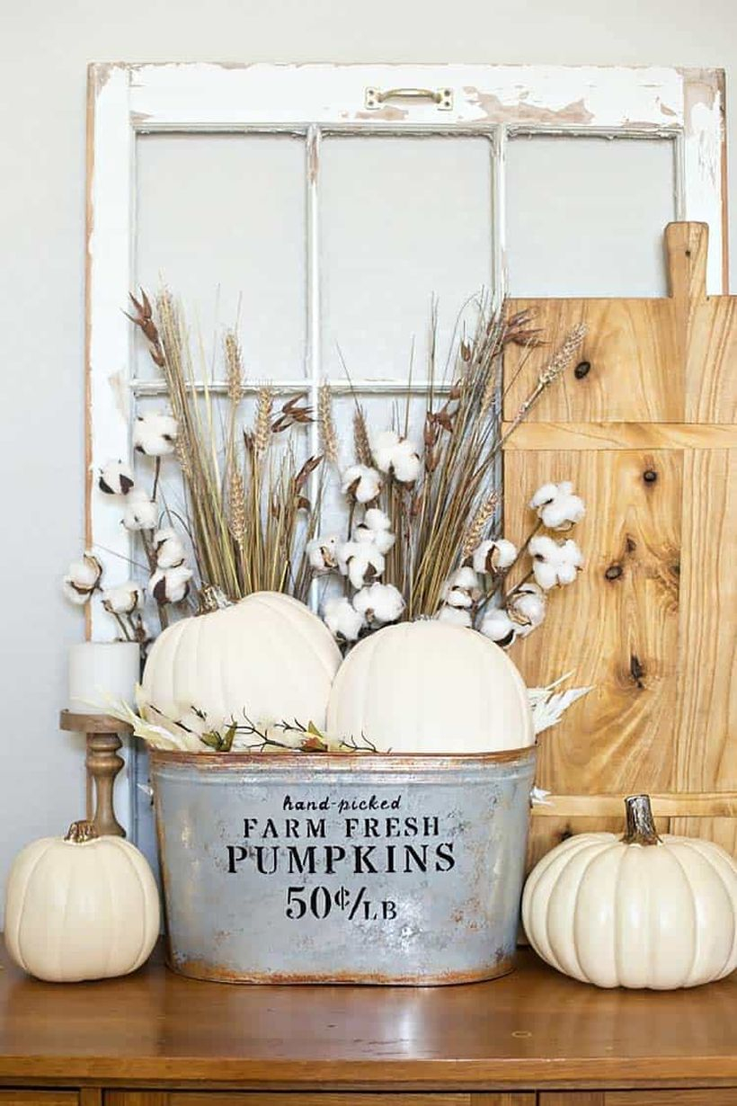 Pumpkin bucket on table.
