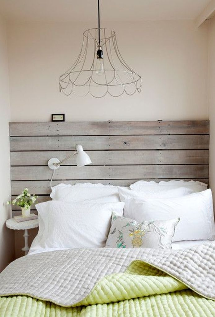 Small bed with wooden headboard