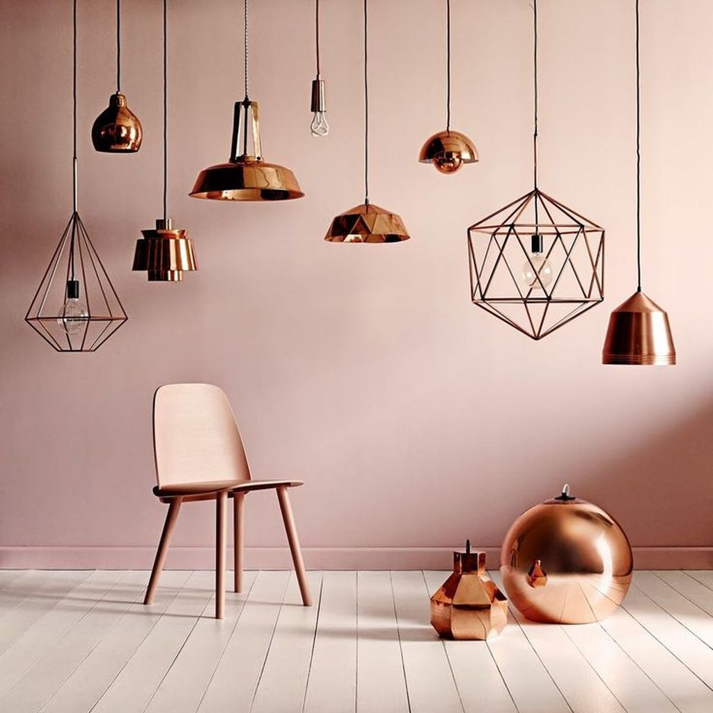 Special and captivating decorating feature with copper hanging lamps and a copper chair to perfect your decoration