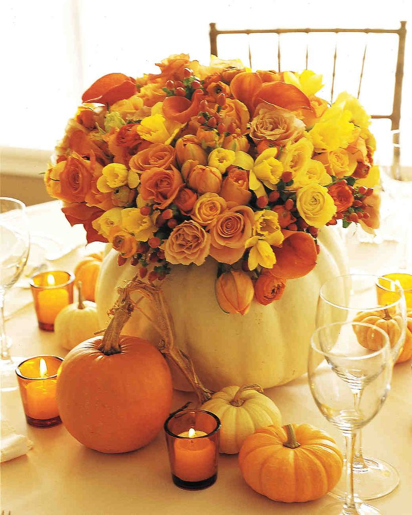 Orange and white pumpkin ornaments with flowers centerpiece ideas