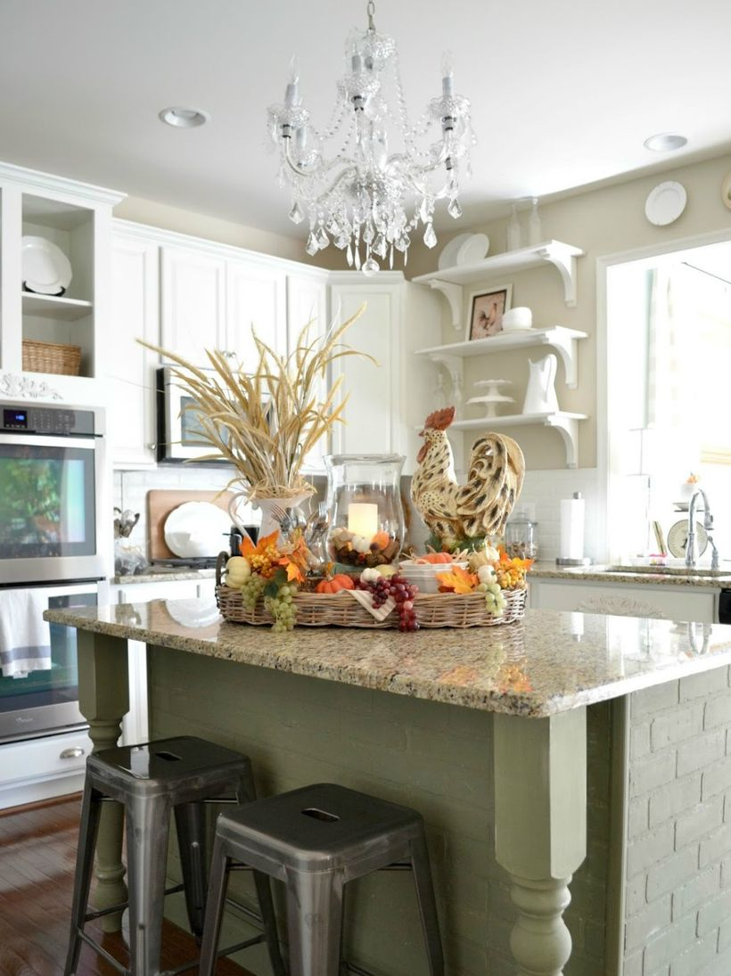 Pumpkin and house plants using for centerpiece decoration on kitchen island
