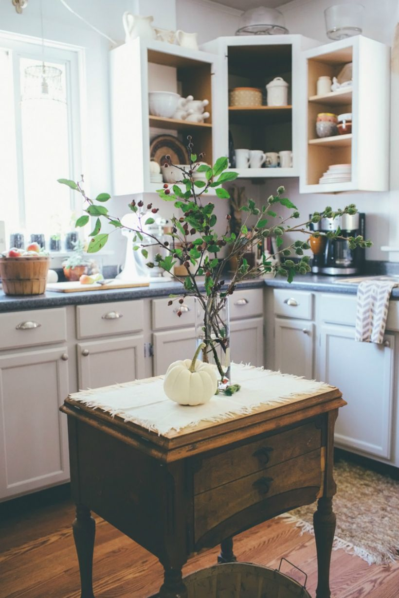 Simple farmhouse kitchen with white pumpkin decoration on wooden table you can try