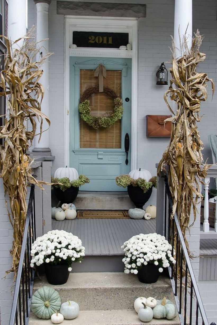 Stunning fall porch decorating ideas with white pumpkins used black pots and flower pots you must try