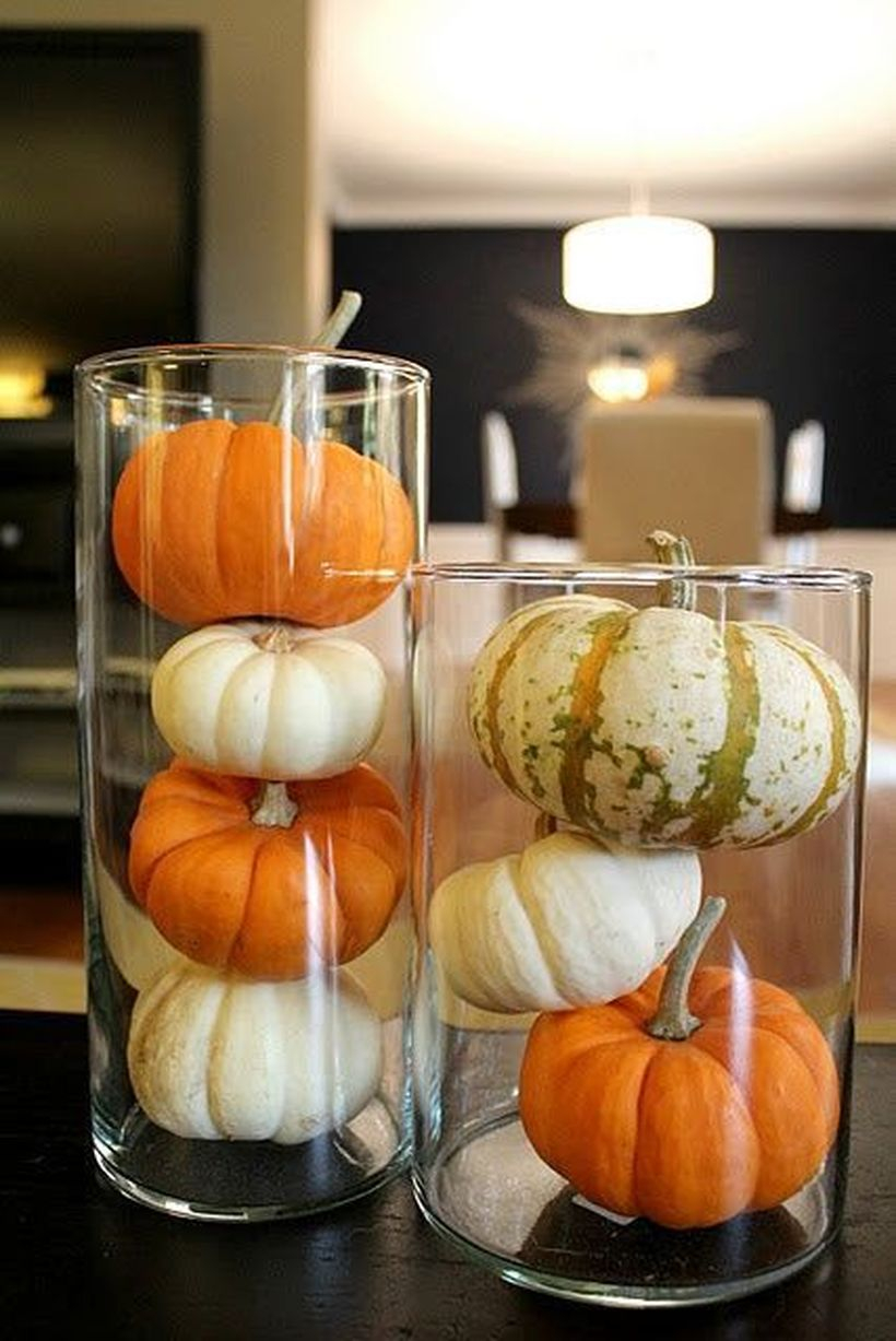 White and orange pumpkins in glass