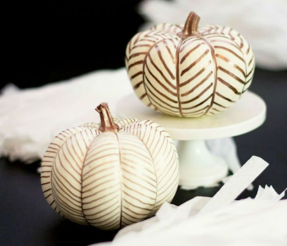 White pumpkins painted