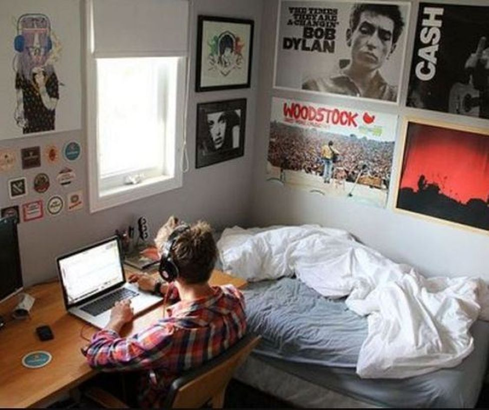 An amazing boys room decoration with gray mattress, white blanket, black photo decoration on the wall and wooden table for study