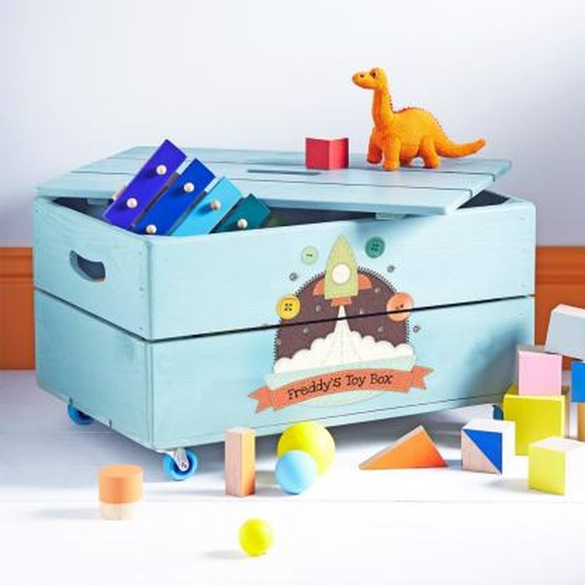 An awesome square storage for children toy with blue color, and small rocket image which can be taken anywhere