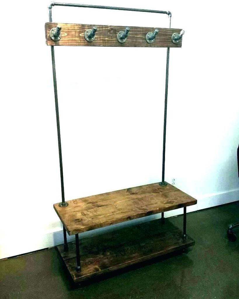 An amazing entryway design with simple bench combined with iron hooks to keep your bag and coat in your entryway