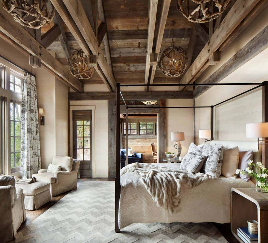 An elegant rustic chandelier for bedroom with athol 6-light globe rustic chandelier, a velvet blanket, grey chairs, a large carpet, big windows, a long curtain and wooden table.