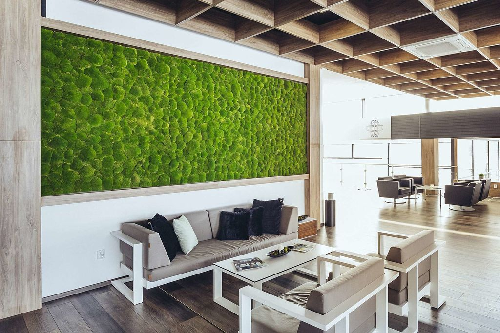 An elegant rustic living room design with wooden ceiling and wooden floor combined with moss wall behind the sofa to perfect your bathroom design