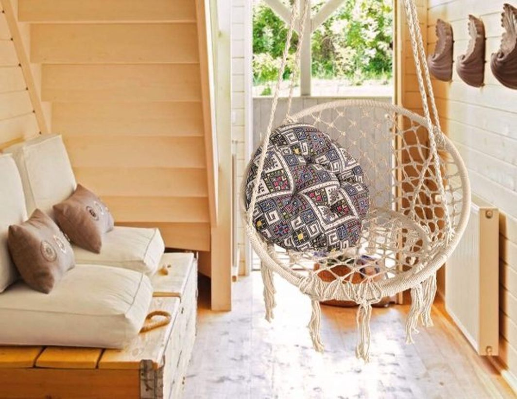 Bohemian charm into your home with a hanging macrame chair.