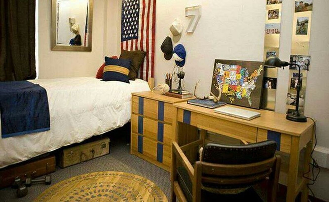 Charming boys room decoration with white mattresses, blue blankets, colorful cushions, and wooden desk chairs for learning to look good