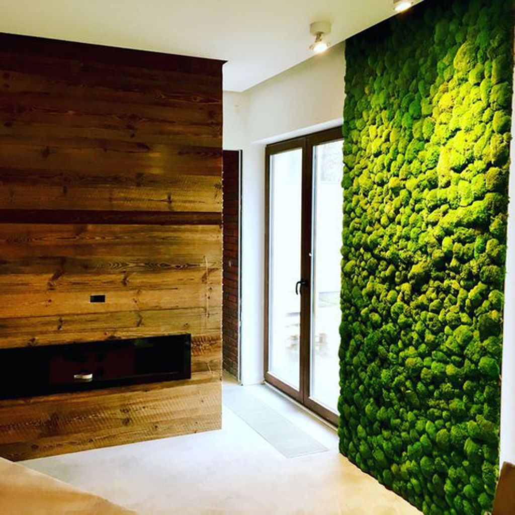 Comfortable modern bedroom decor with fireplace and moss wall in the wall to perfect in your bedroom decoration