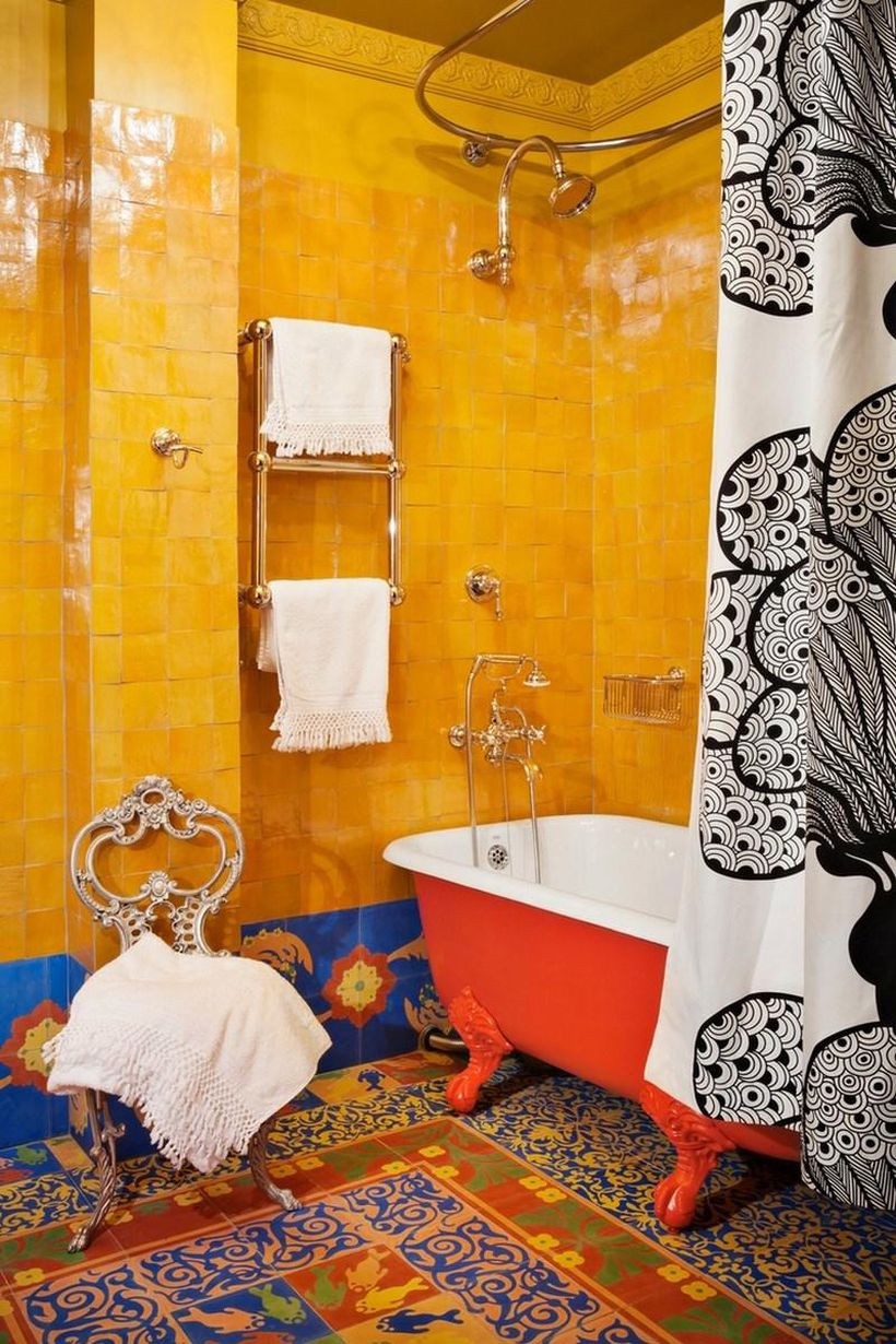 Cool boho bathroom decor with black patterned curtains in white, colorful tiles, and yellow walls to make it look smart