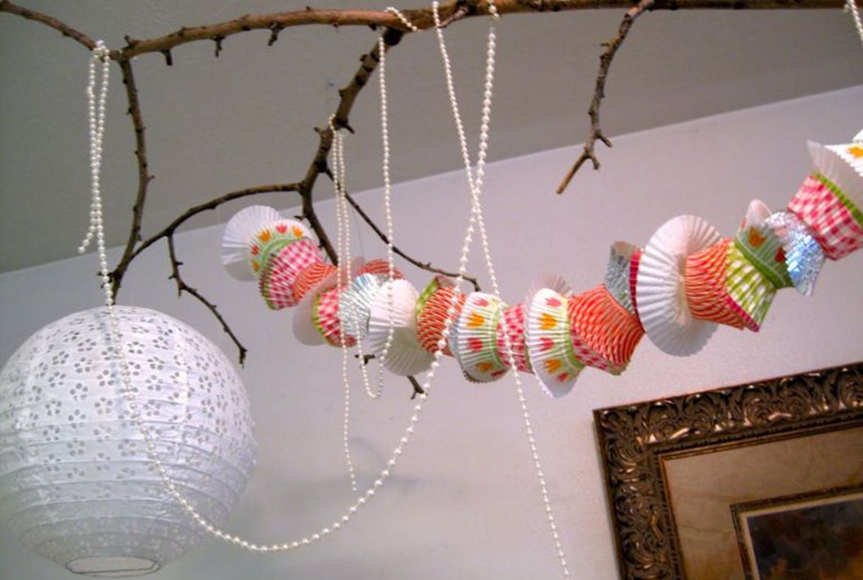 Creative ornament birthday party decoration with cupcake liner garland to look interesting