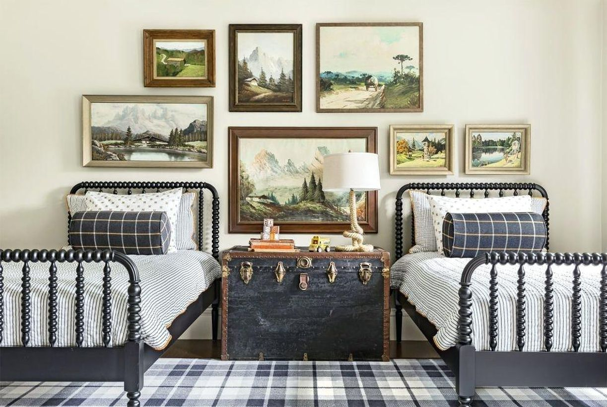Creative boys room decoration with gray bed, black white striped mattress, white pillow, checkered carpet and decorative landscape painting on the wall
