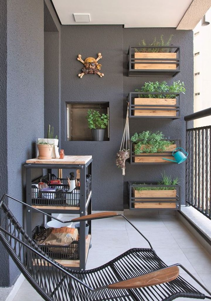 Dark walls for small balcony combined with vertical garden on the wall