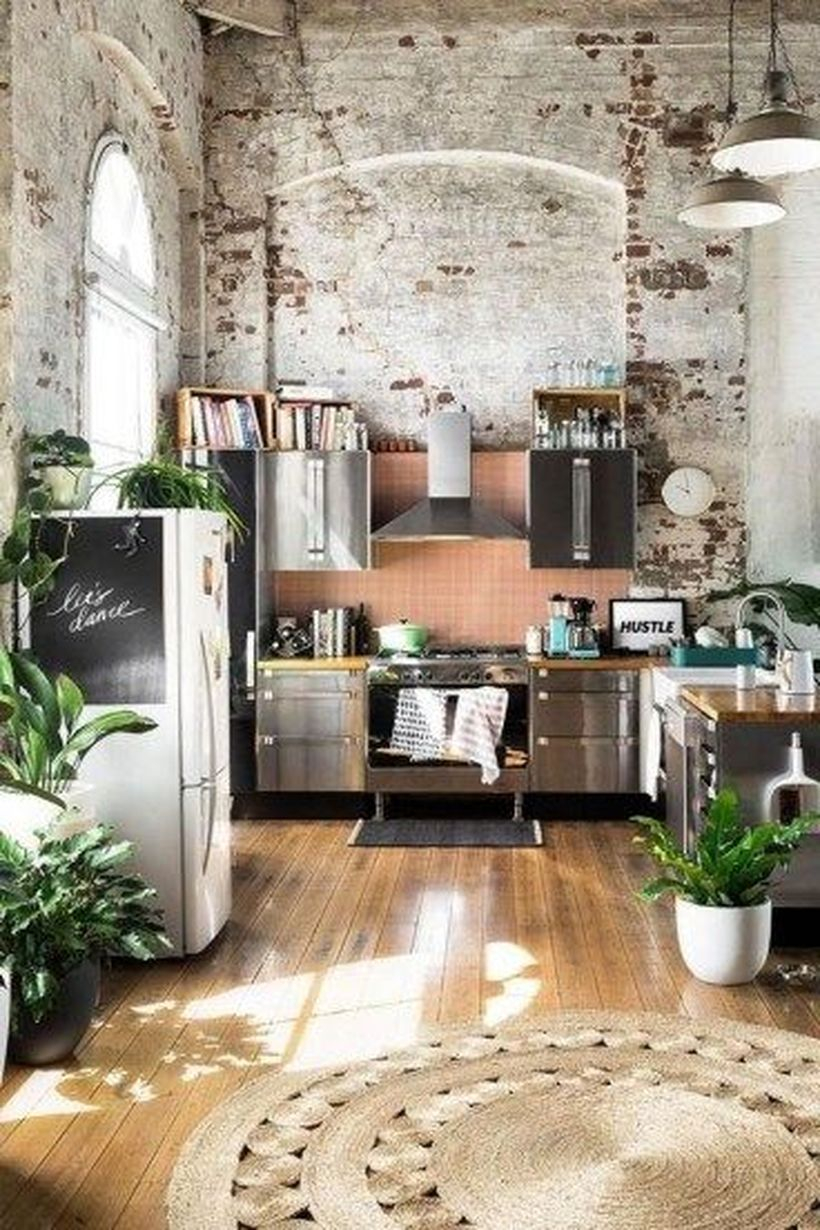 Fabulous boho kitchen decor with brown patterned circular carpet designs, wooden floors, modern, and green plants as decoration