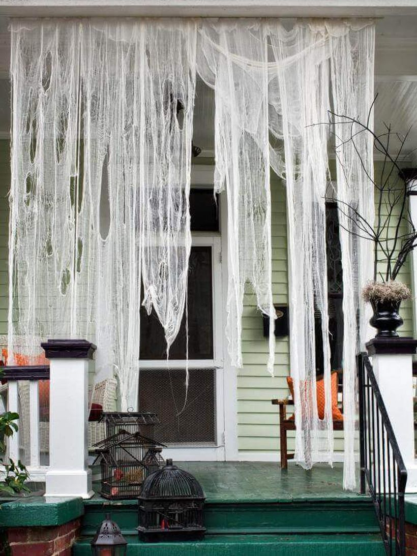 Hanging cobwebs halloween door.