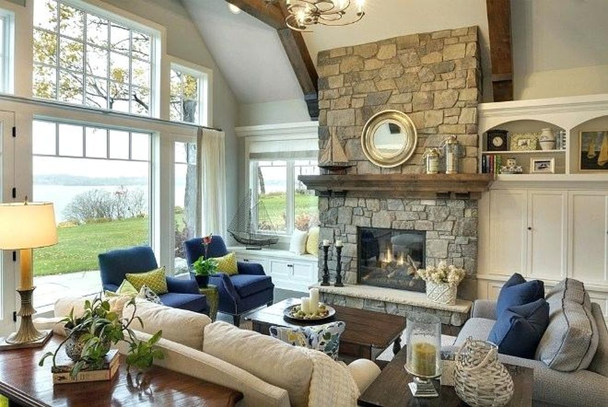 Lake house interior design with an amazing stone fireplace, to lift the atmosphere in your room, attach the elements to the gallery wall of the room or use it as a bookshelf accent to give family memories of eclectic chaos and add extra hard personal touches.