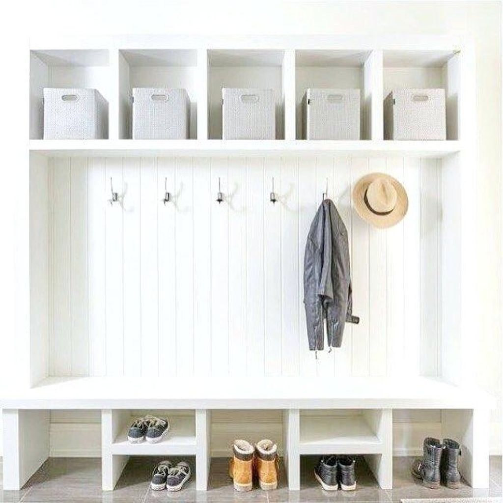 Modern entryway design with white bench combined with iron hooks below shelf medium size to keep your bag, hat and coat in your entryway
