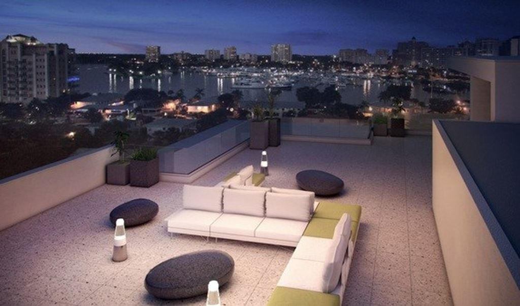 Modern small rooftop lighting with led lights combined an elegant sofas and unique table to perfect your rooftop design