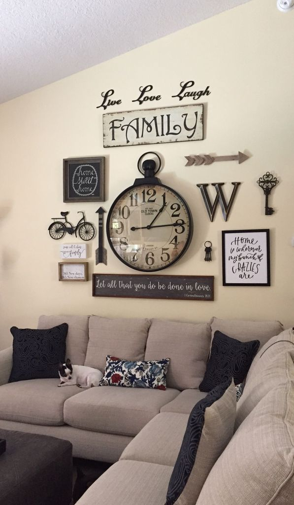 Old clock in the middle wall gallery to perfect your living room