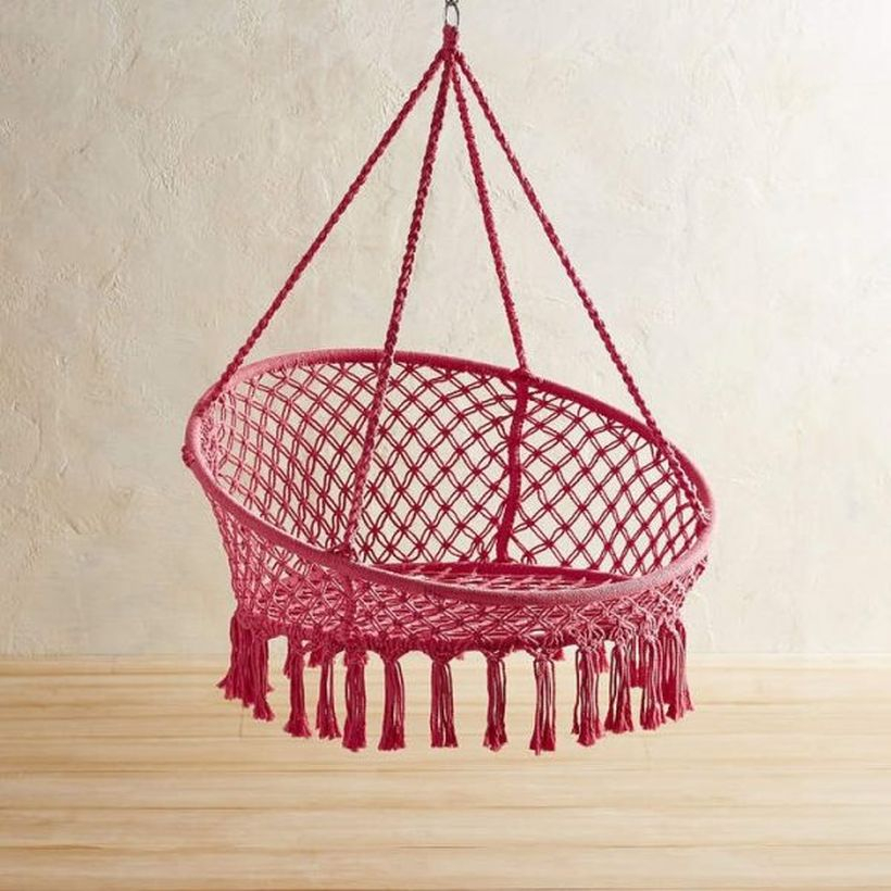 Pink macrame saucer swing chair.