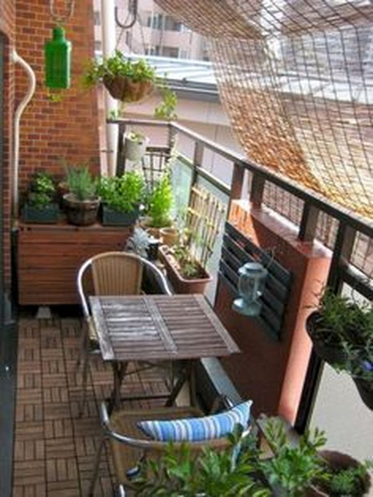 Rattan chairs combined with wooden table for small balcony