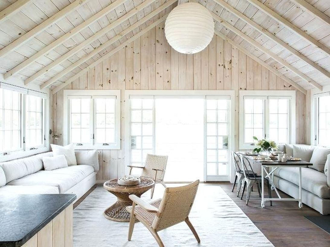 The complete interior design of a lake house transforms this very traditional southern house into a stunning lake house interior design, bringing the natural atmosphere into the house with a hardwood wall that gives you a soothing and peaceful life while indoors.