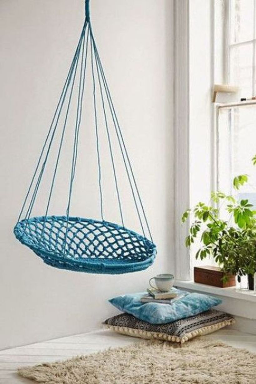 Turquoise macrame hanging chair will add color to the space.