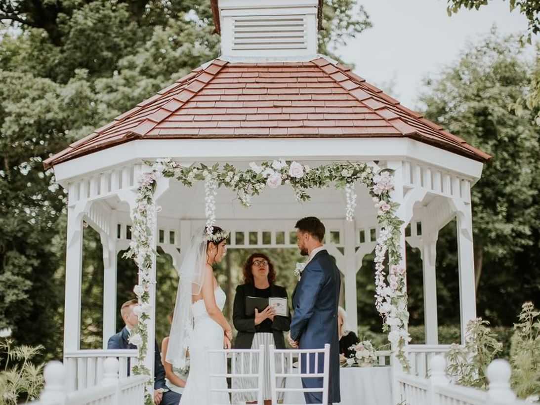 Venue wedding decoration with arrangment flower arch on pergola to look an elegant