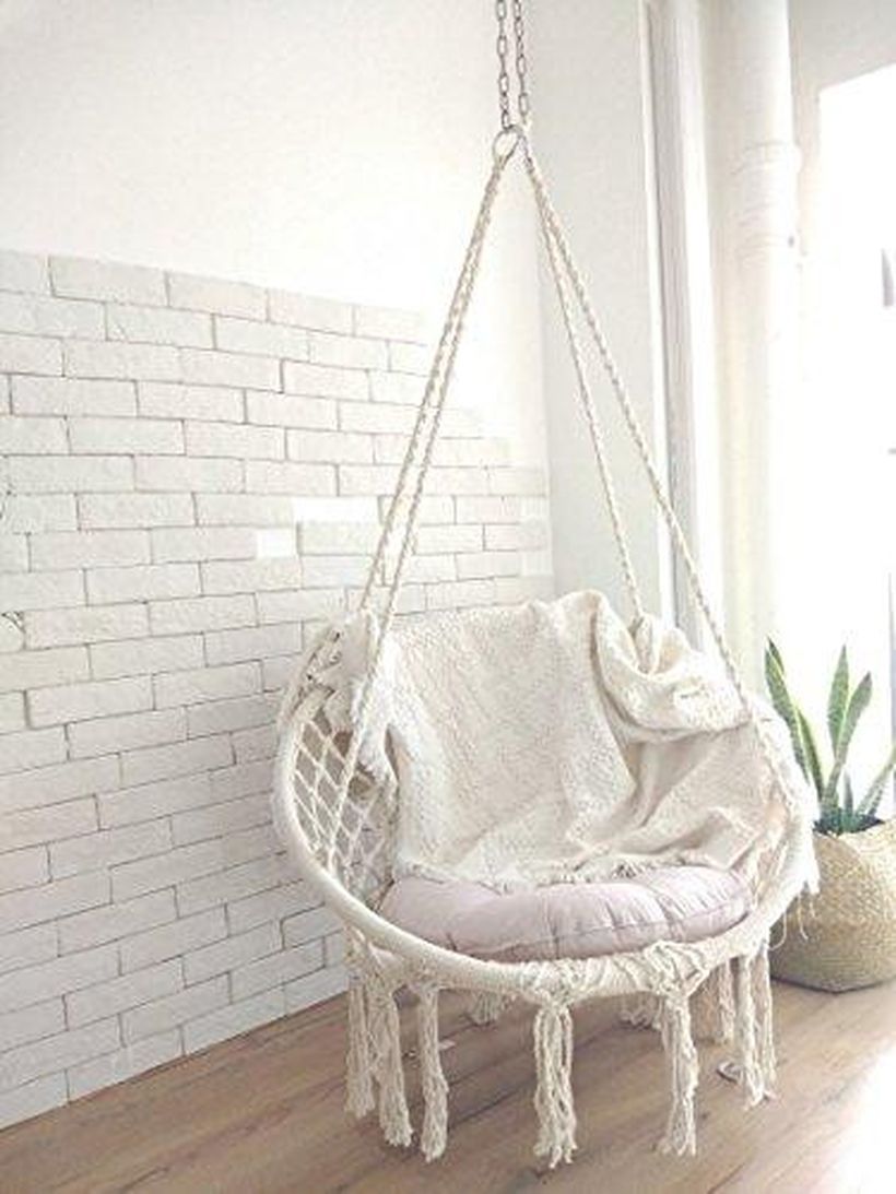 White hanging macrame chair.