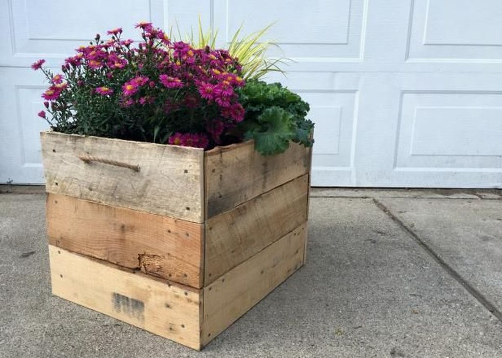 Wooden pot combined with purple flowers