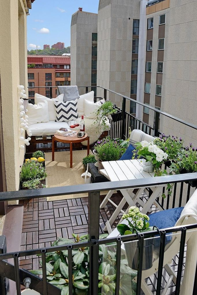Wooden table and plants decoration to perfect your balcony