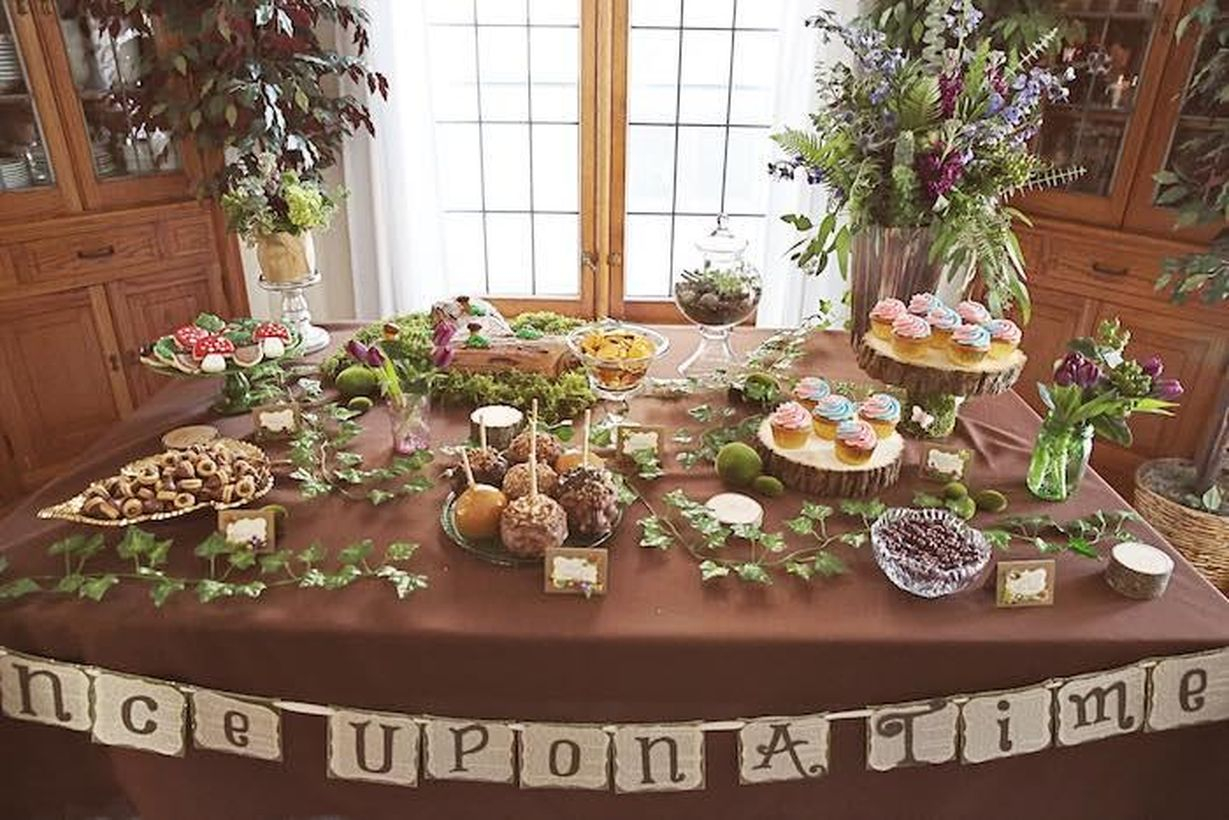 An arrangement flower vase and greenery on table set for fun birthday party decoration