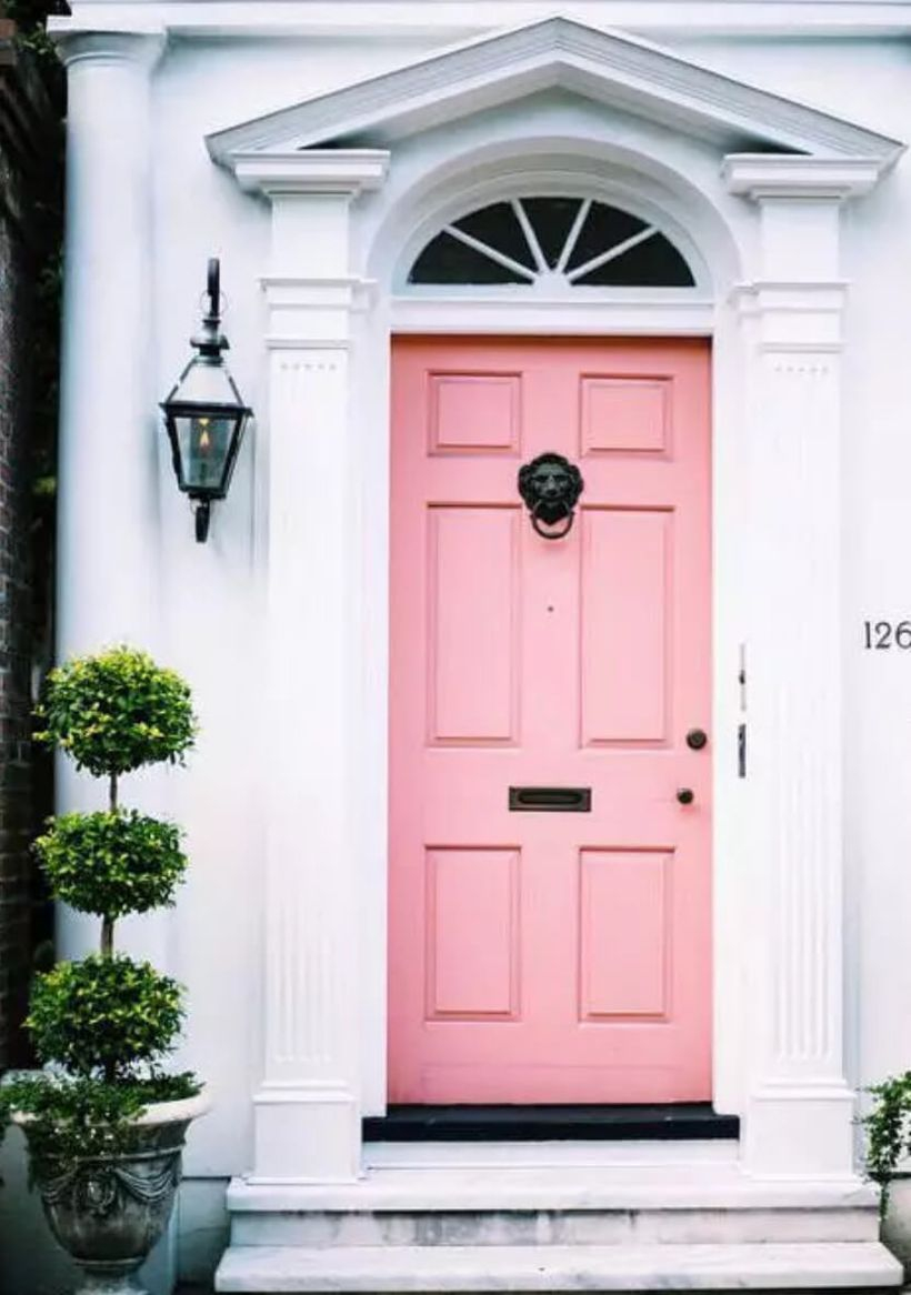 Beautiful front door decoration with a pink door to make it look cute when guests come home