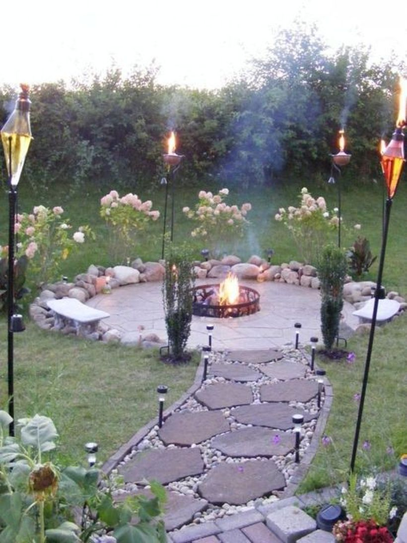 Beautiful round fir pit from iron in backyard