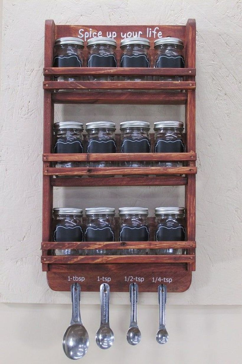Brown wooden spice rack on the wall