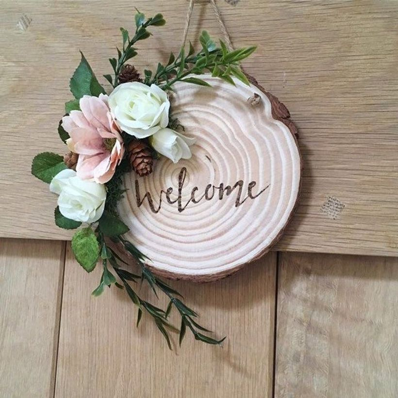 Creative front door decoration with wooden beam welcome front door sign and add white flowers