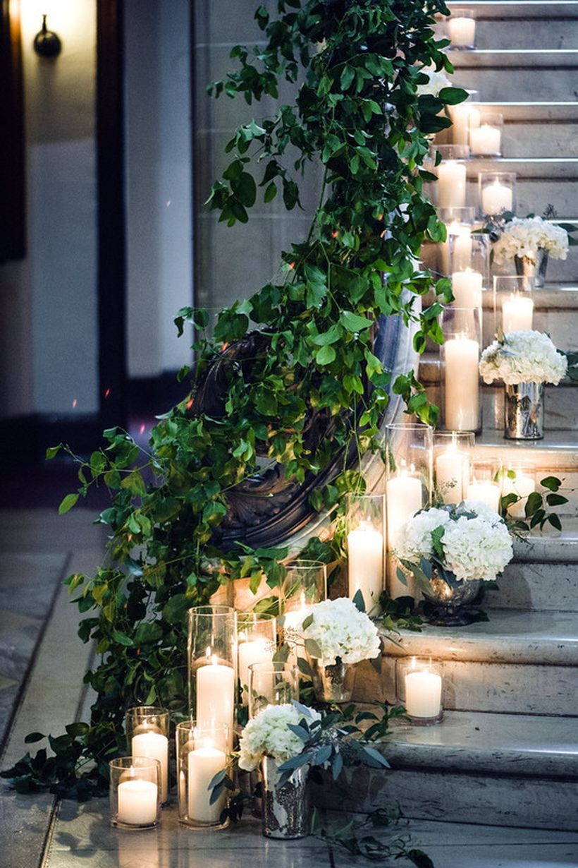 Guide guests from point a to point b with decorative candle and greenery to create romantic atmosphere