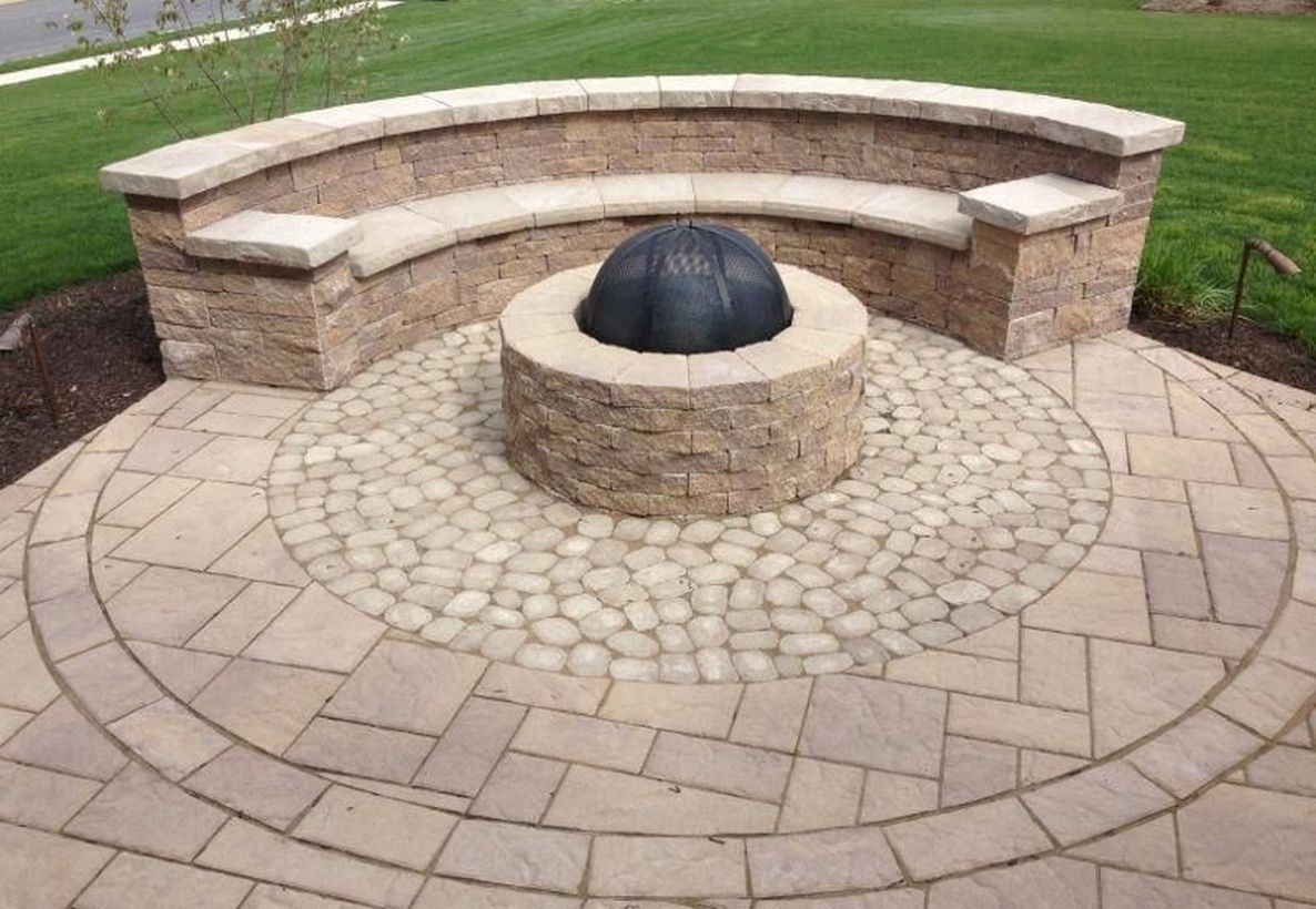 Outdoor curved fire pit with natural stone