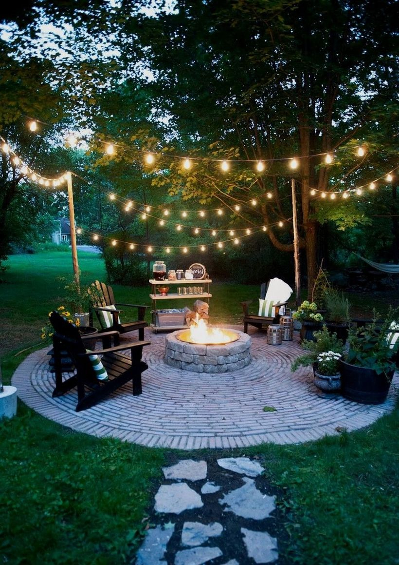 Outdoor fire pit with decorative lighting