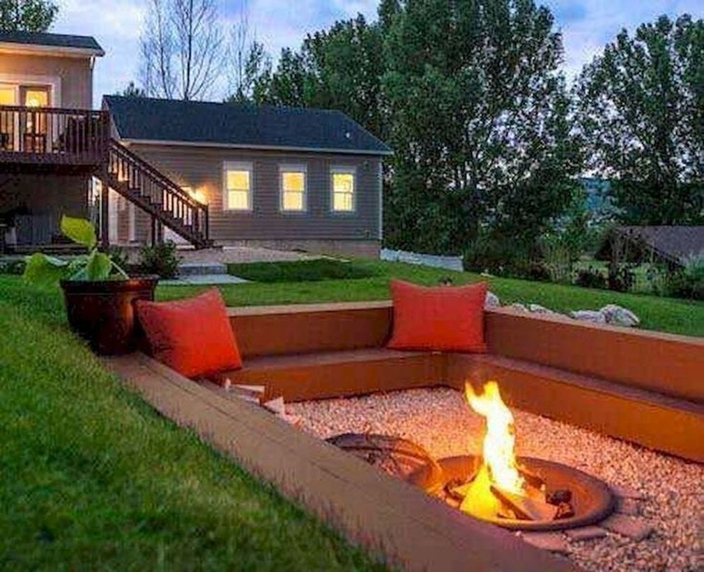 Portable fire pit and red sofa cushions