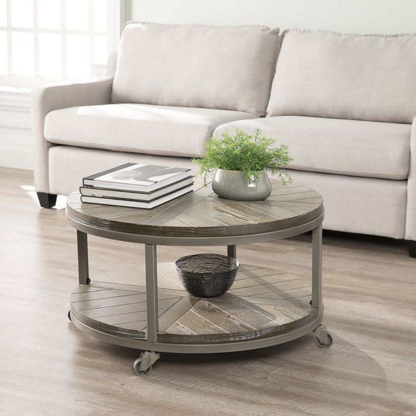 Round coffee table with wheel underneath