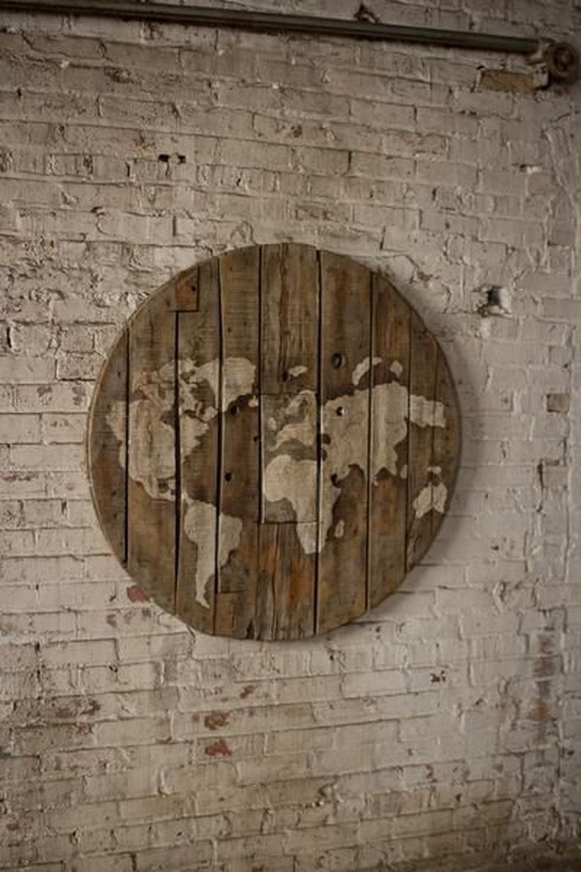 Round wooden pallet painted world map