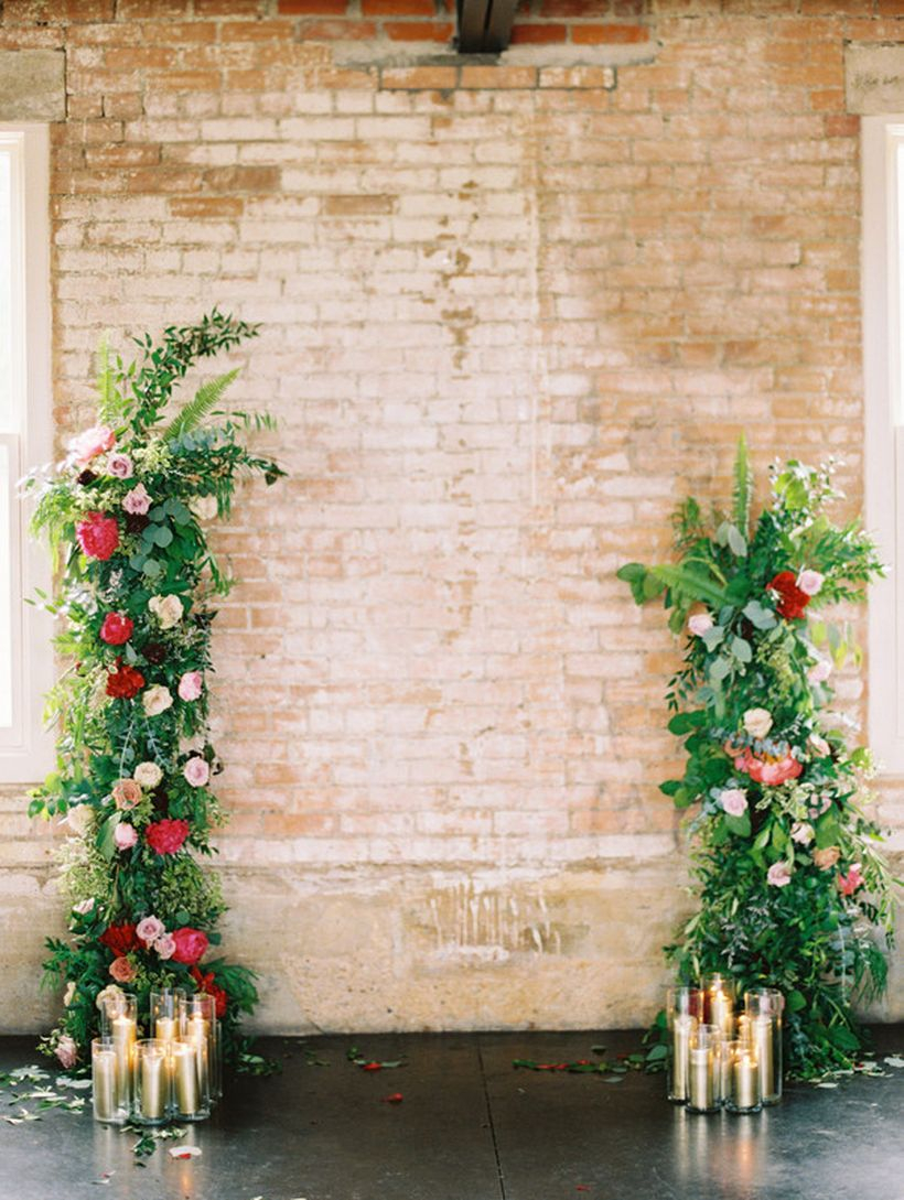 Rustic backdrop wedding decoration with floral accents and arrangement candles
