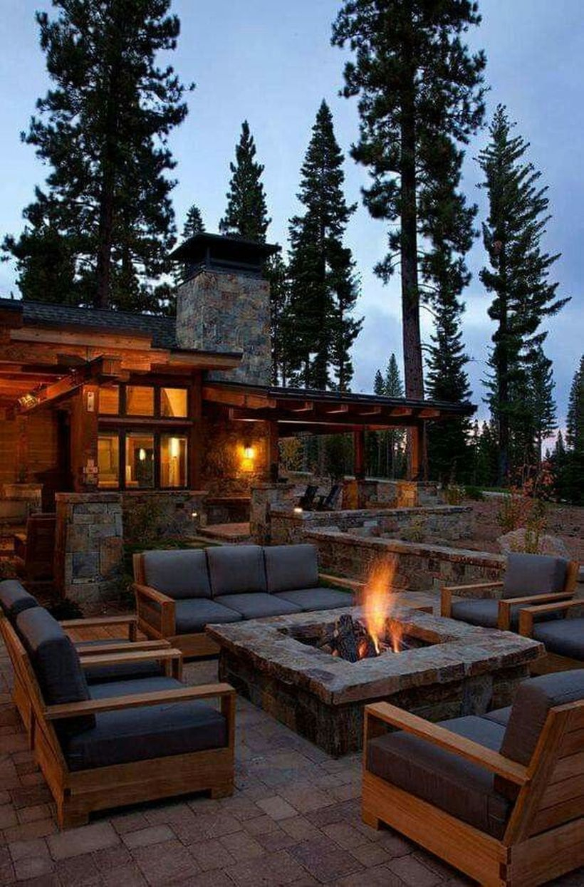 Stunning square fire pit with wooden sofas