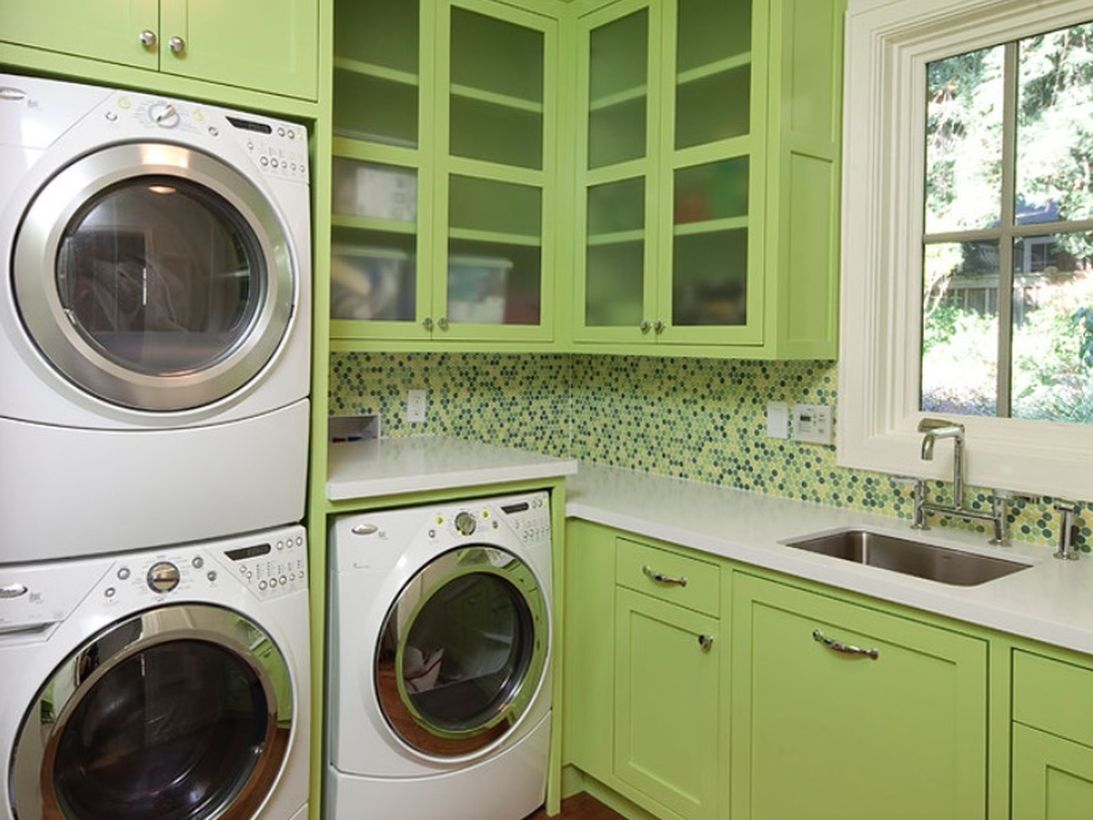 Washing machine with light green wooden cabinet storage