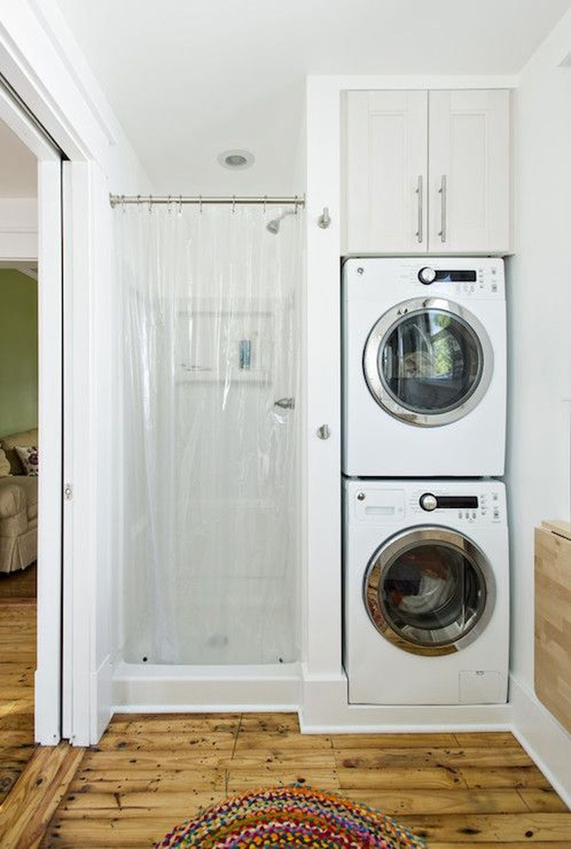 Washing machine with small white cabinet storage